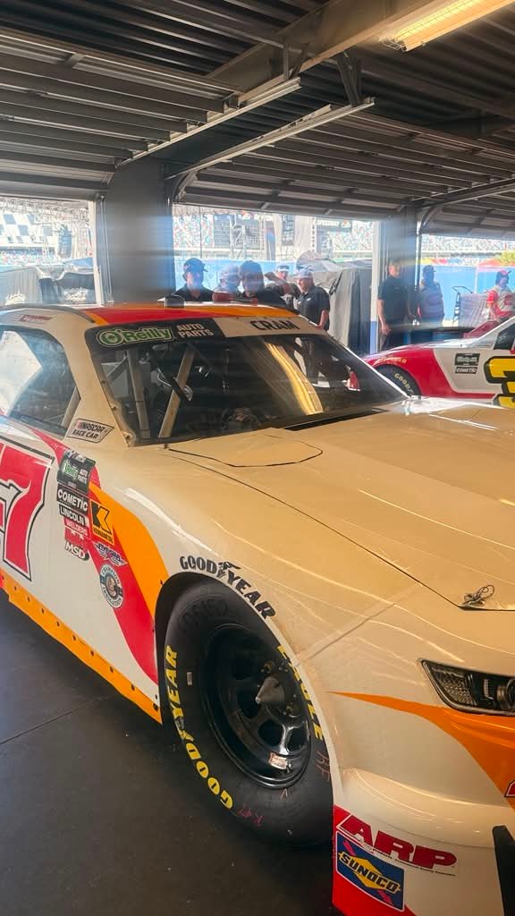 Number 47 stock car in a garage