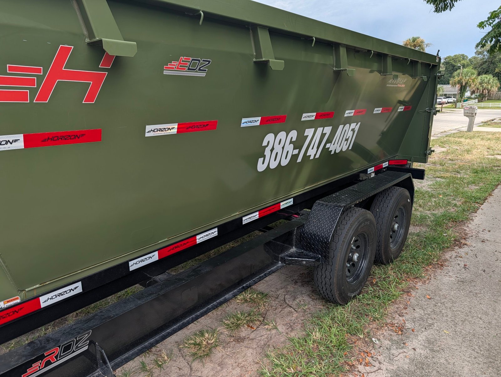 Reflective Dumpster Decals on a real Same Day Vinyl dumpster project
